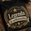 Vintage-tyylinen syntymäpäivä t-paita tekstillä Legenda jo syntyessään, kultaisen ja kerman sävyinen retroembleemi tummalla pohjalla